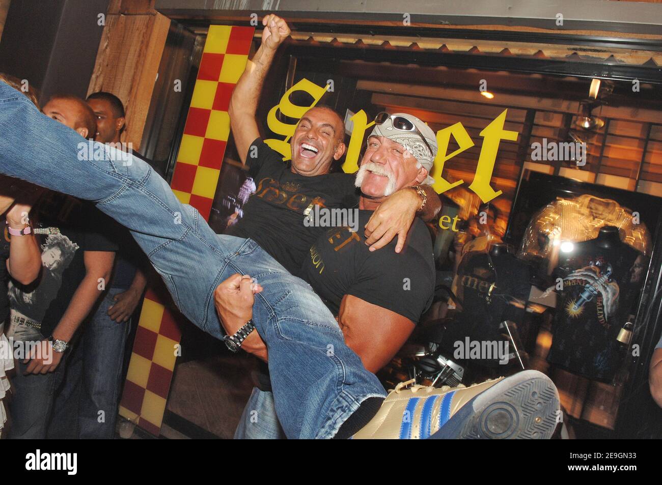 Christian Audigier presents, with Hulk Hogan, 'Smet ', his latest fashion collection honoring French rock legend Johnny Hallyday in his store of Melrose Avenue in Los Angeles, CA, USA on July 29, 2006. Photo by Lionel Hahn/ABACAPRESS.COM Stock Photo