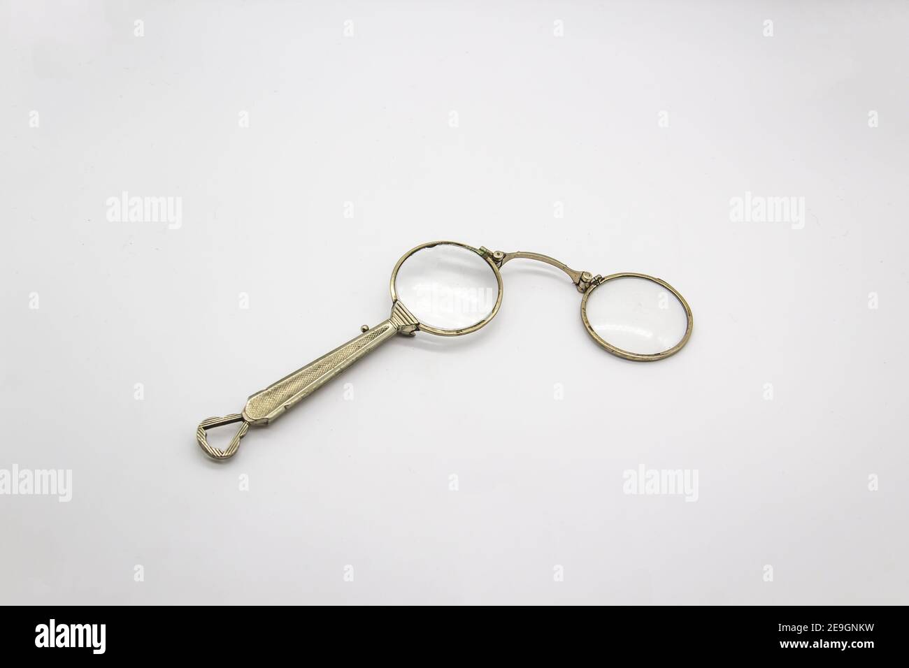 Old vintage lorgnette from the middle of the nineteenth century on the white background Stock Photo