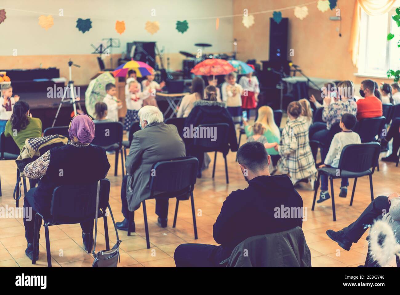 Parents at the performance of children in kindergarten or school ...