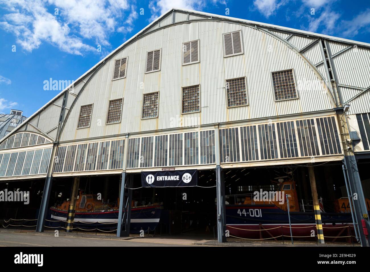 Front facade & entrance to the Number 4 boathouse (covered slip) which houses RNLI HISTORIC LIFEBOAT COLLECTION: UK's largest collection of RNLI Life boats. Chatham historic dockyard England UK (121) Stock Photo