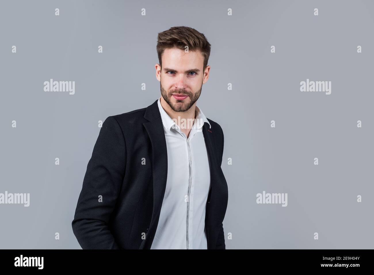 stylish guy with trendy hairstyle wear office suit, atelier Stock Photo -  Alamy