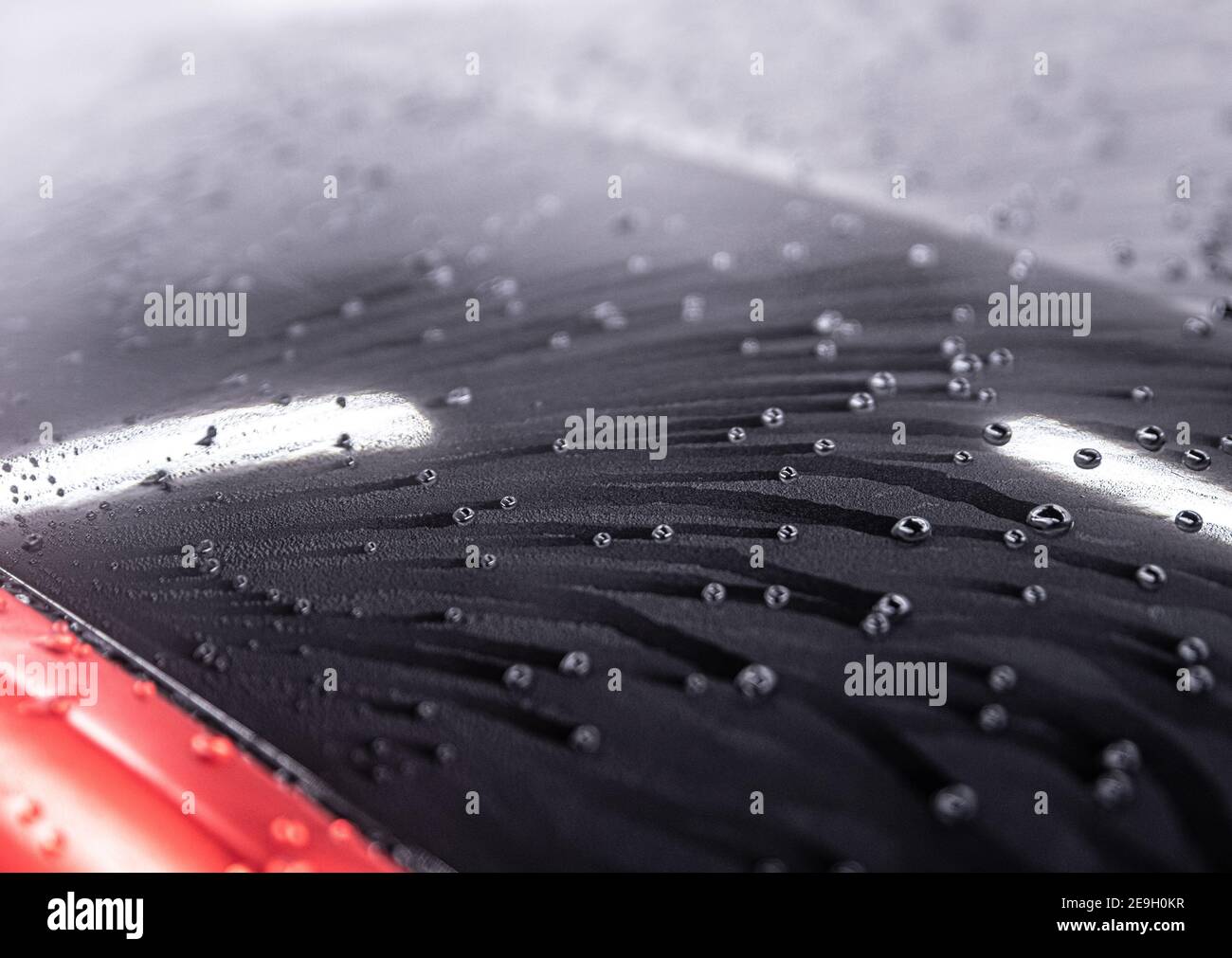 Water drops on car paint. Hydrophobic water effect on car body Stock
