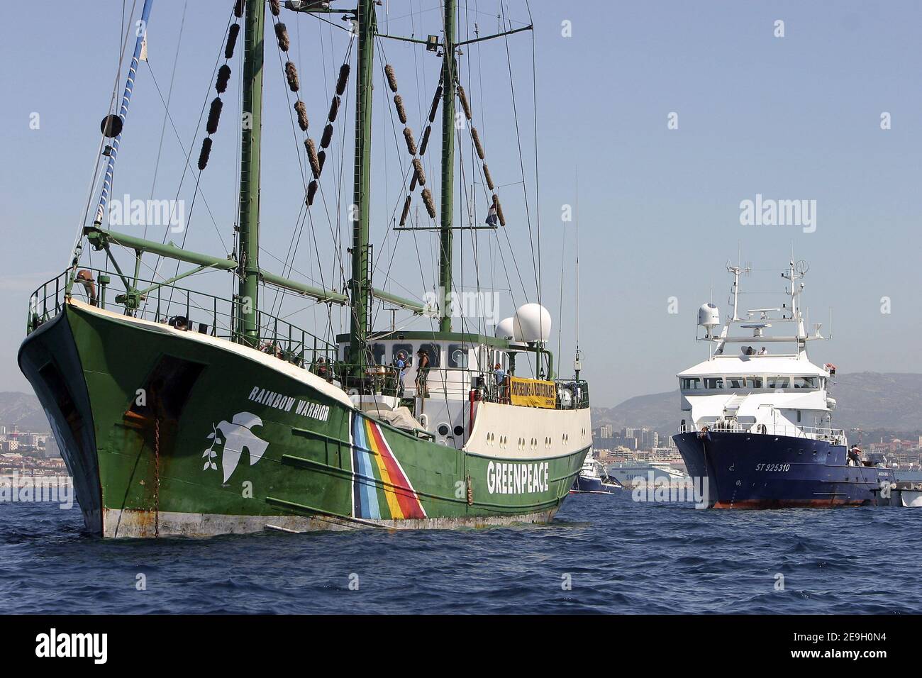 Greenpeace's Rainbow Warrior II is circled by tuna fishing vessels to prevent it from docking, as it tries to move into Marseille's harbour, August 23, 2006. Fishermen in the southern French port city of Marseille have used Greenpeace's own tactics against it to prevent the environmental activist group's flagship from docking.. Rainbow Warrior II campaigns to save dwindling red tuna stocks. Photo by Gerald Holubowicz/ABACAPRESS.COM Stock Photo