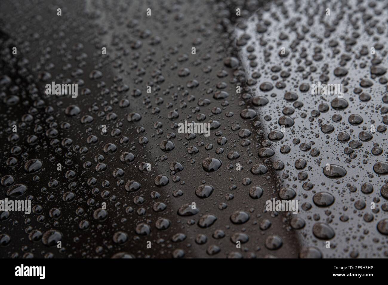 Water drops on car paint. Hydrophobic water effect on car body Stock