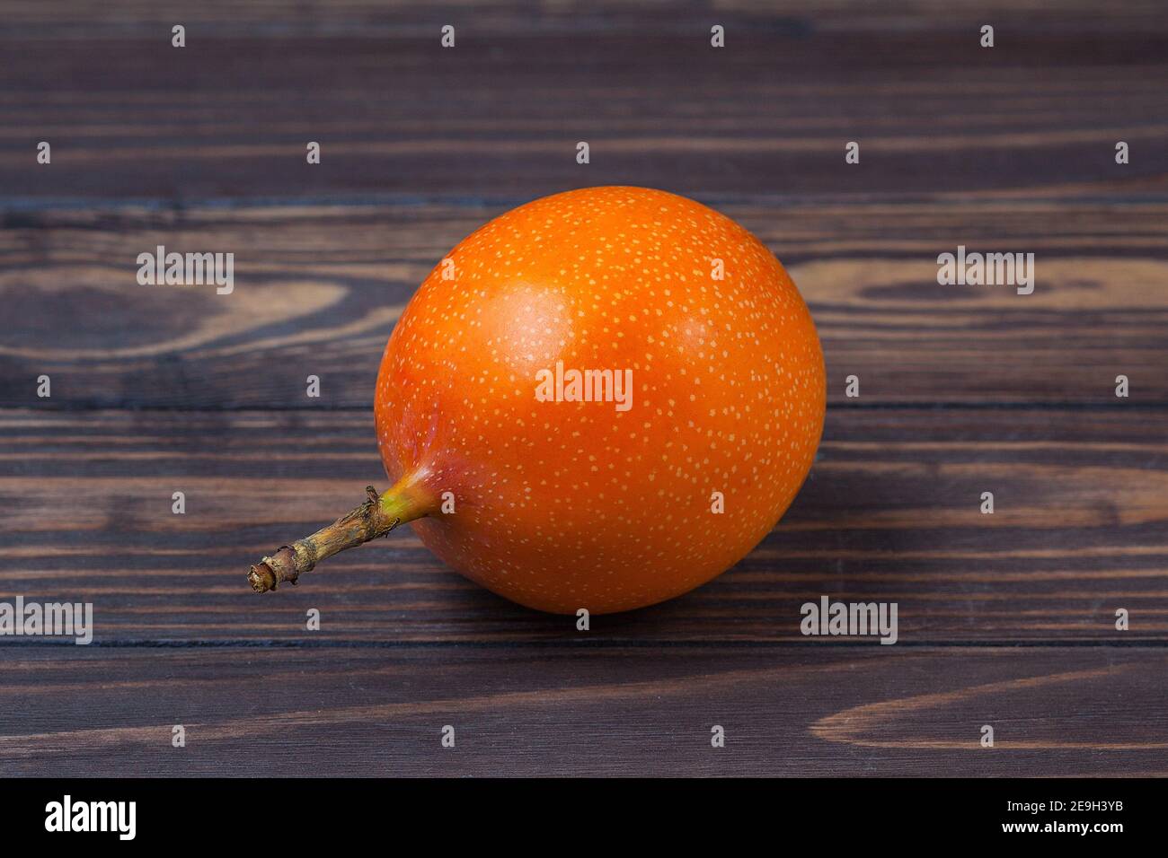 Ripe grenadil fruit, lie on a background of wooden boards. High quality photo Stock Photo