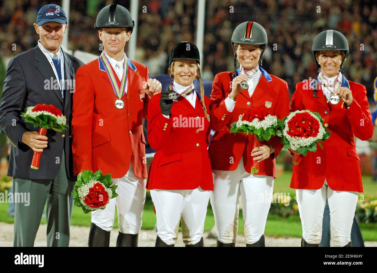 USA's team (L-R) Georges Morris (coach), McLain Ward, Margie Engle, Beezie Madden and Laura Kraut won the silver medal during the jumping team competition at the FEI World Equestrian Championships, in Aachen, Germany, on August 31, 2006. Photo by Edwin Cook/Cameleon/ABACAPRESS.COM Stock Photo