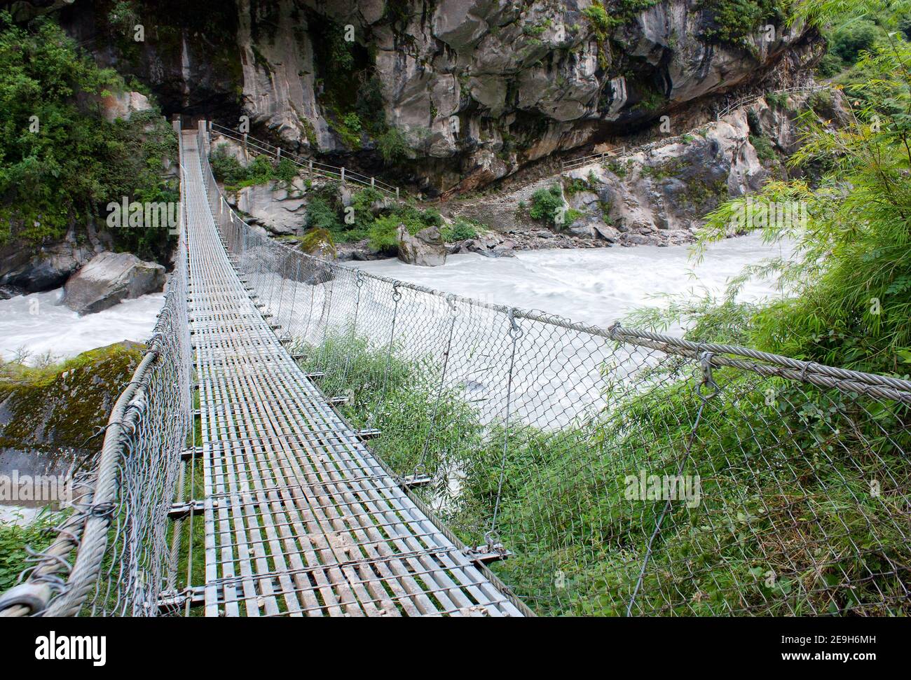 rope hanging suspension bridge Everest base camp trek in Nepal Stock