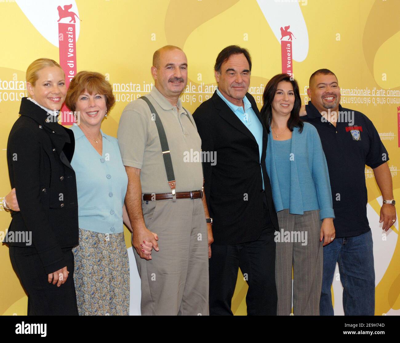 Director Oliver Stone and castmember Maria Bello pose with real life 9/11 NYPD and FDNY survivors portrayed in the movie William and Alison Jimeno and John and Donna McLoughlin during the photocall for their new film 'World Trade Center' at the 63rd annual Venice Film Festival in Venice, Italy, on September 1, 2006. Photo by Nicolas Khayat/ABACAPRESS.COM Stock Photo