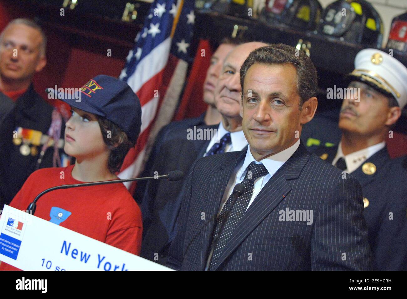 French interior minister Nicolas Sarkozy presents the Medal of Honor of french firefighters to FDNY, in New York City, NY, USA, on September 10, 2006. Standing next to him is Aidan Fontana, 10, who lost his father David on September 11, 2001. Photo by Lionel Hahn/ABACAPRESS.COM Stock Photo