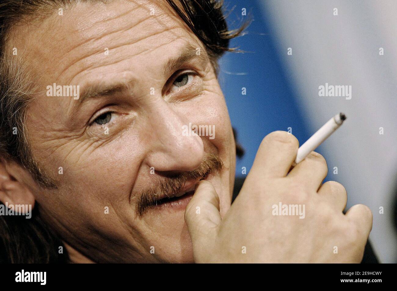 US actor and cast member Sean Penn smokes a cigarette as he attends the  press conference for the film 'All the King's Men' during the Toronto  International Film Festival held at the