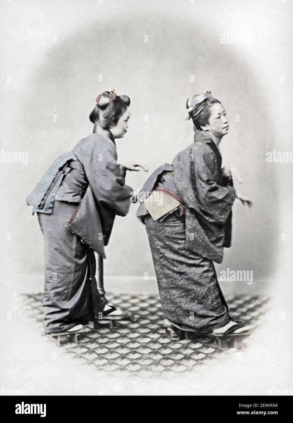Late 19th century photograph - Japanese dancers, Japan, c.1860's,'The Grecian Bend'. Felix Beato studio. Stock Photo