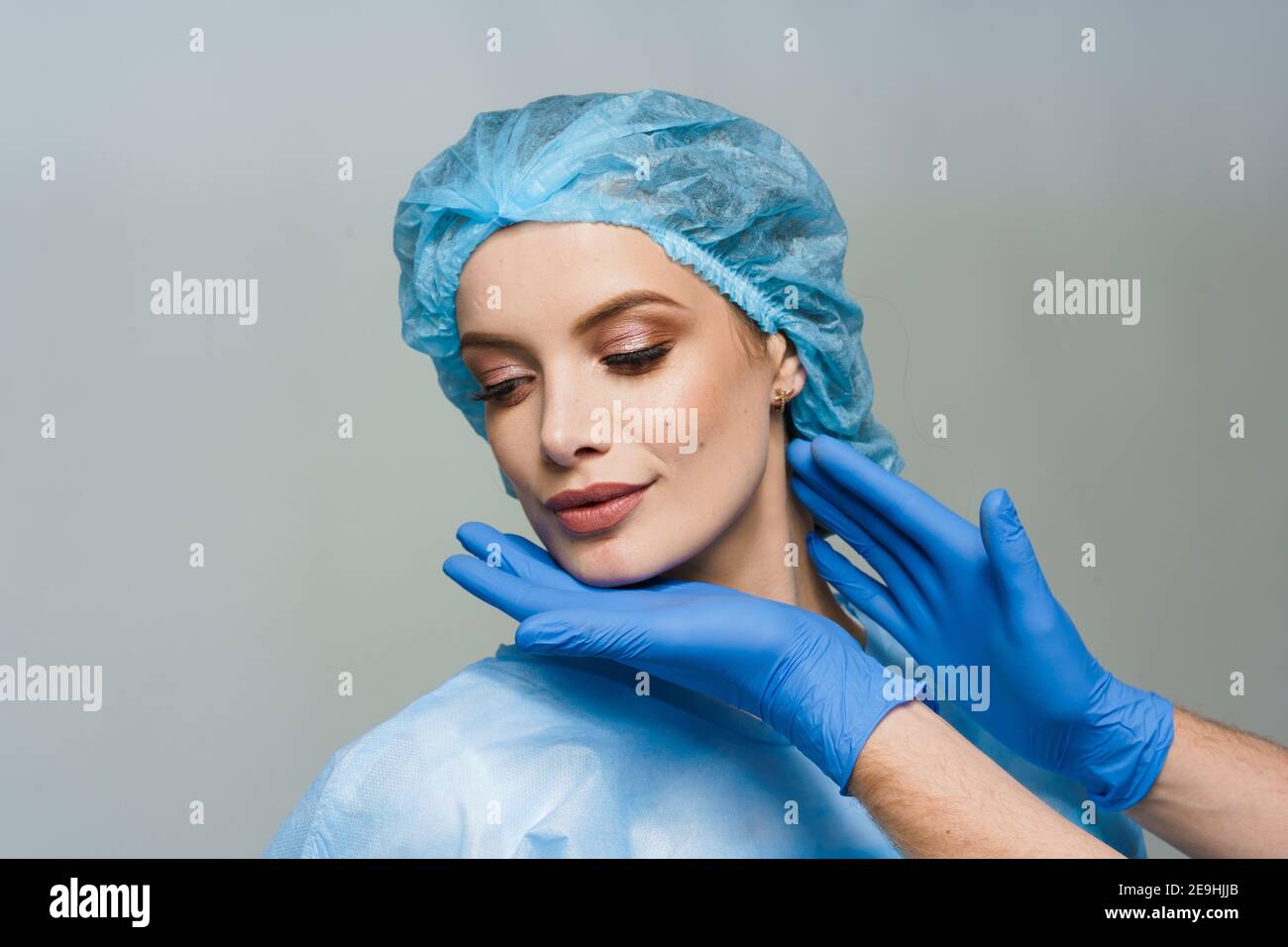 Consultation with plastic surgeon on white background. Cosmetic