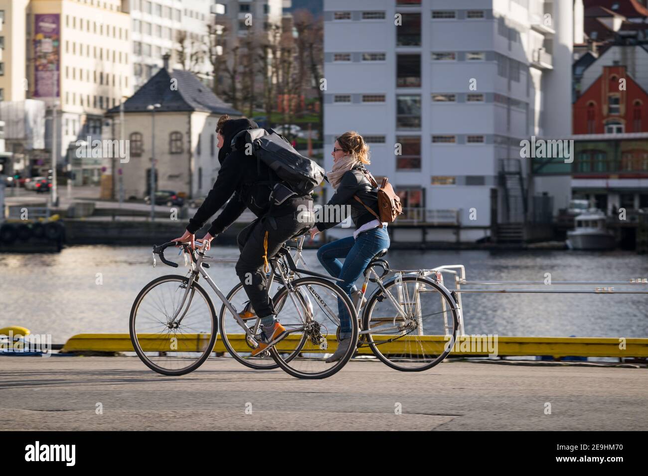 Cyclists, Bryggen, Bergen, Norway. Stock Photo