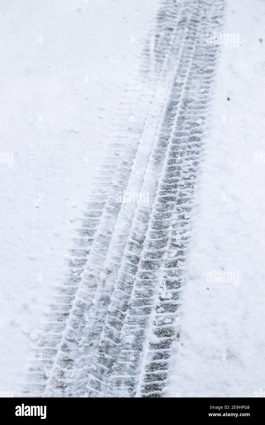 Tire tracks in the snow through the woods Stock Photo - Alamy