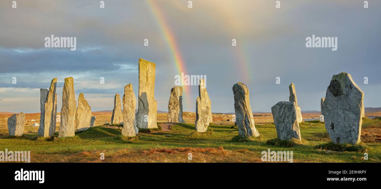 Isle of Lewis and Harris, Scotland: Double rainbow and clearing sky at the Callanish Standing Stones Stock Photo
