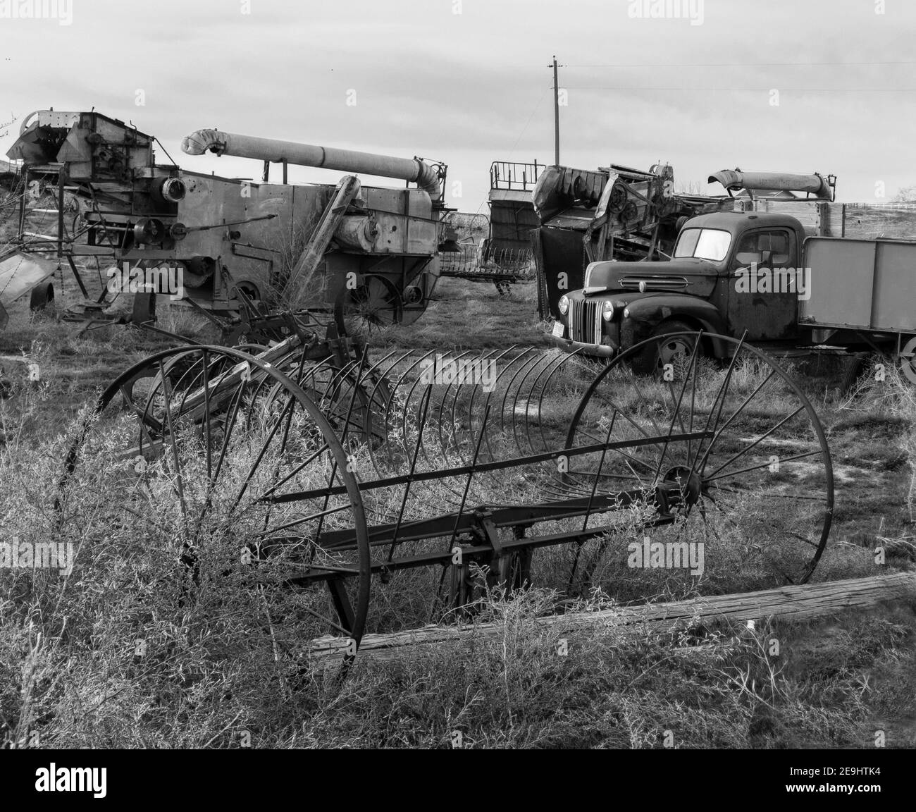 Old truck and farm equipment in rural southwest Idaho Stock Photo