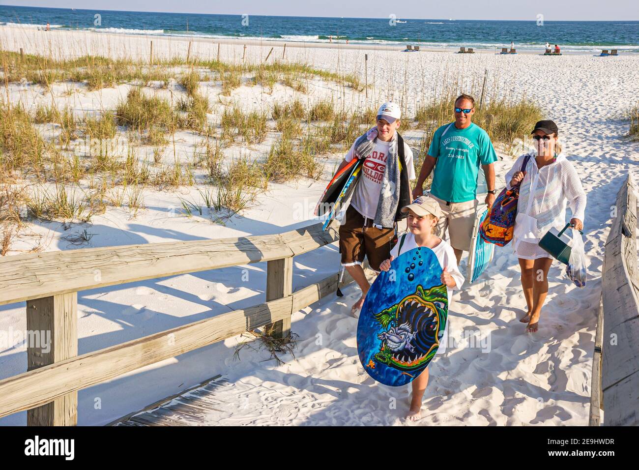 Alabama Orange Beach Island House hotel boardwalk,public beach sand dunes Gulf of Mexico,family mother father son daughter siblings, Stock Photo
