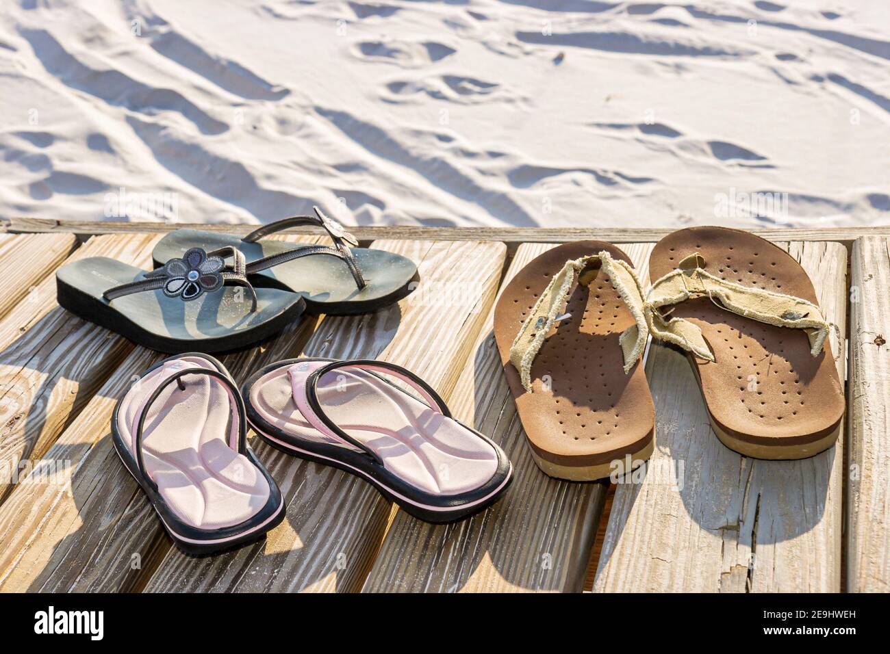 Alabama Orange Beach Island House hotel Gulf of Mexico Coast,boardwalk shoes sandals pairs, Stock Photo