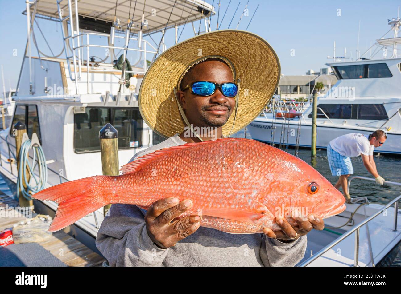 Alabama Orange Beach Zeke's Landing Red Snapper Tournament,Black man holding caught fish catch, Stock Photo