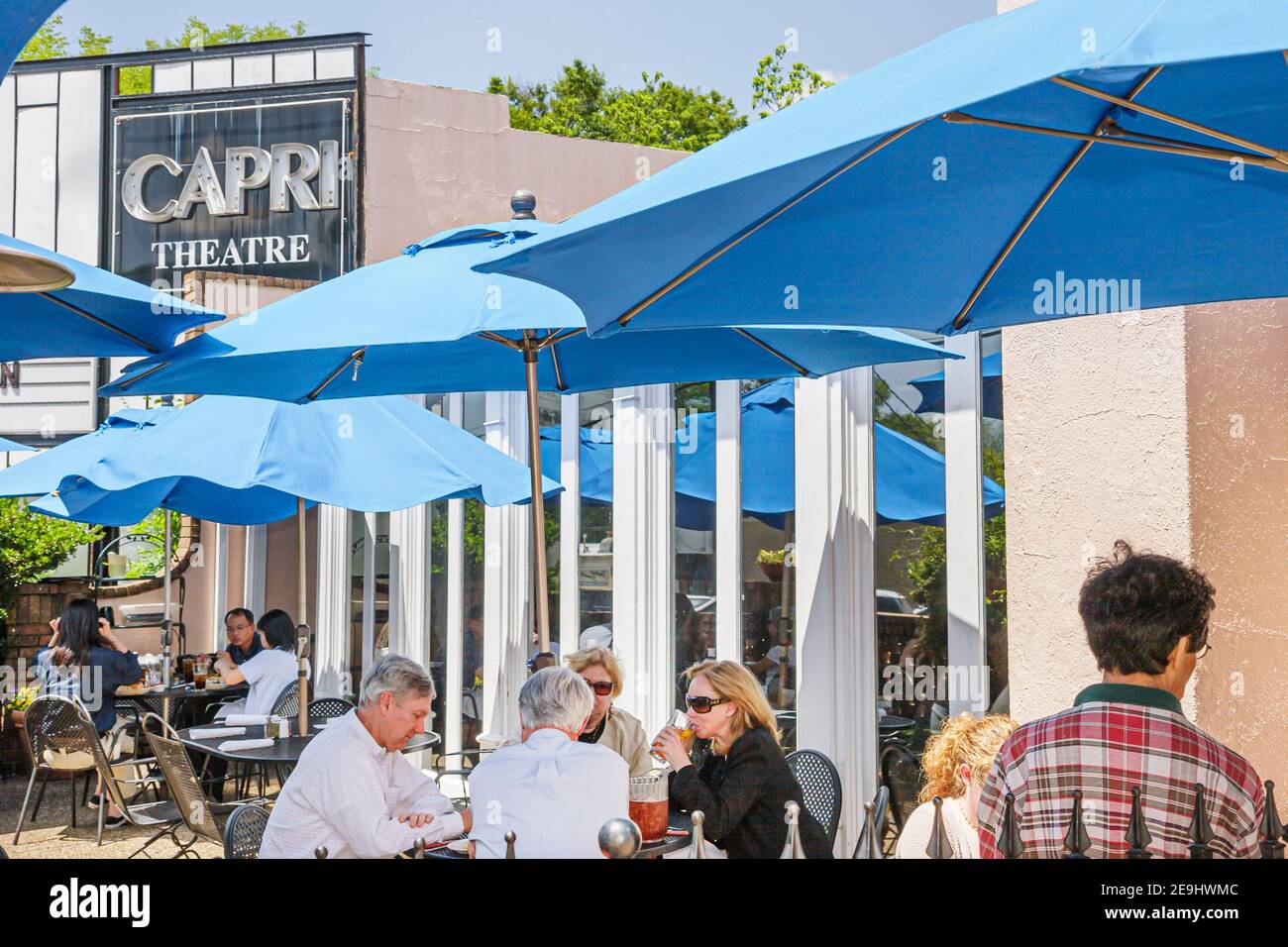 Alabama Montgomery Cloverdale Sinclair's Restaurant dining al fresco,Capri Theatre theater tables umbrellas, Stock Photo