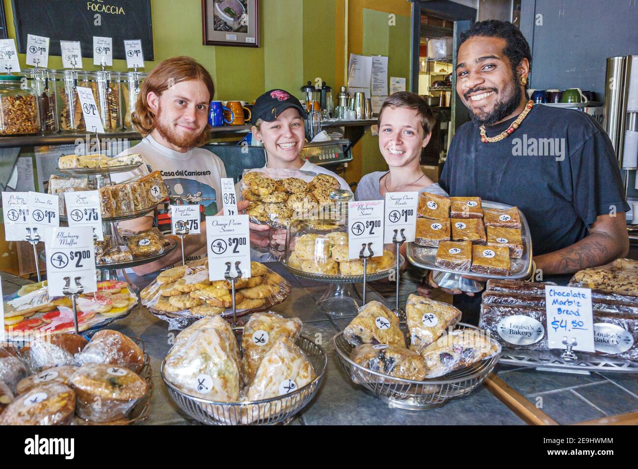 Alabama Montgomery Cloverdale Tomatinos Pizza & Bake Shop,employees Black man woman female counter display desserts baked goods, Stock Photo