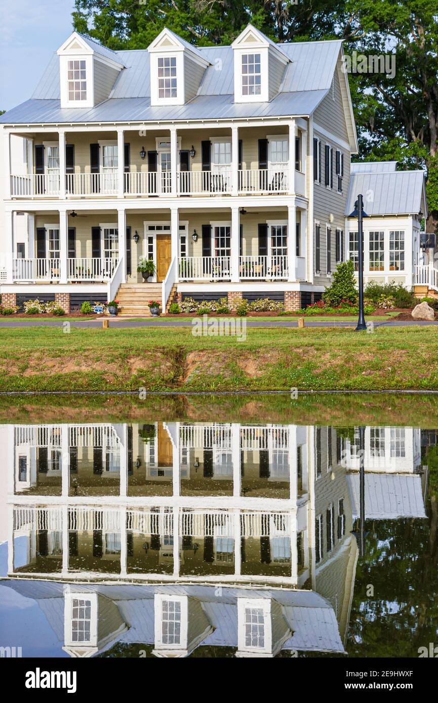 Alabama Montgomeery Pike Road The Waters planned community homes,traditional Americana architecture porch front entrance exterior water reflection, Stock Photo