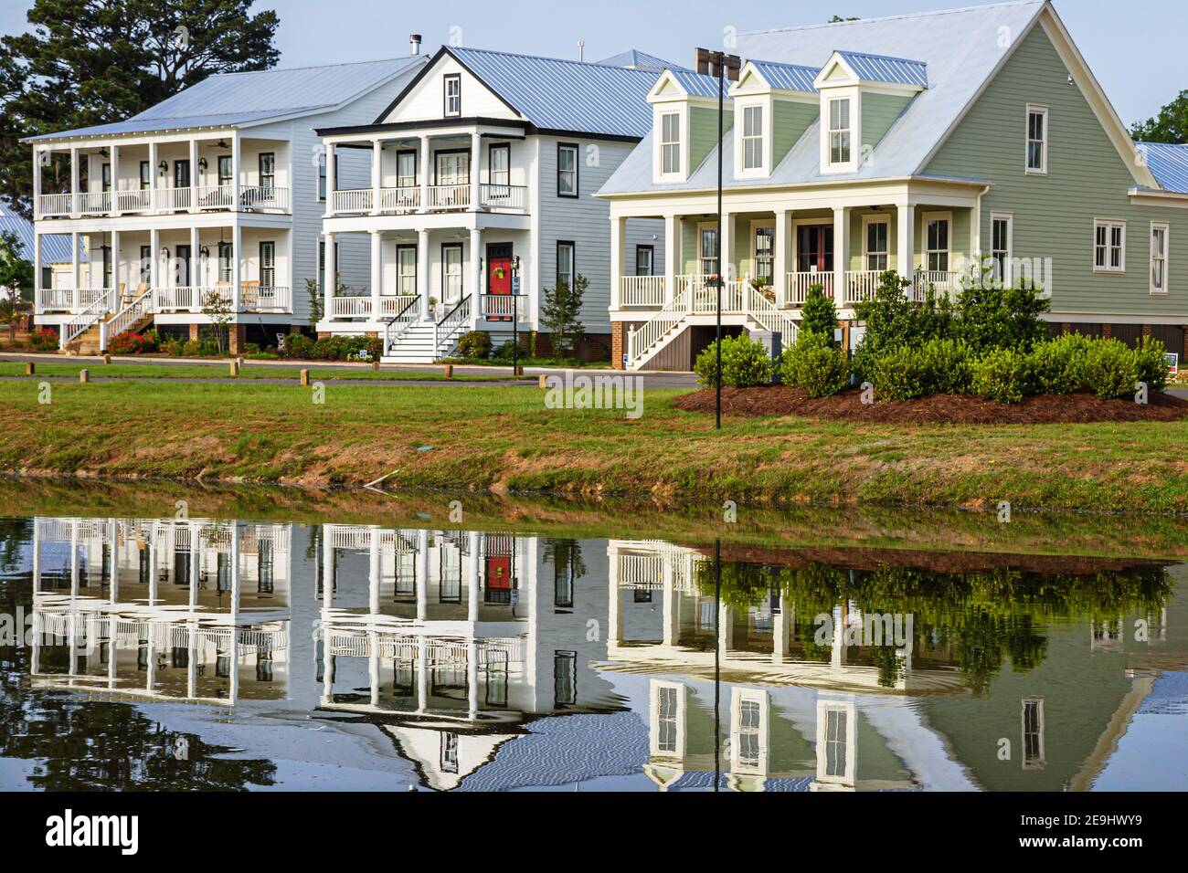 Alabama Montgomeery Pike Road The Waters planned community homes,traditional Americana architecture porch front entrance exterior water reflection, Stock Photo