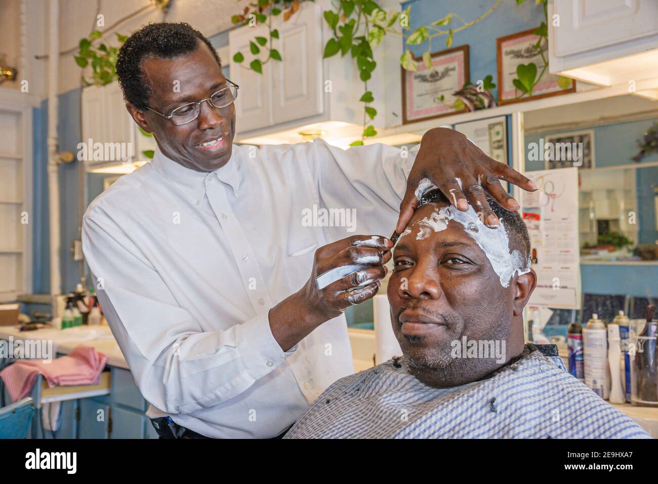 Birmingham Alabama,4th Avenue District sign historic neighborhood,Black man men male barber customer, Stock Photo