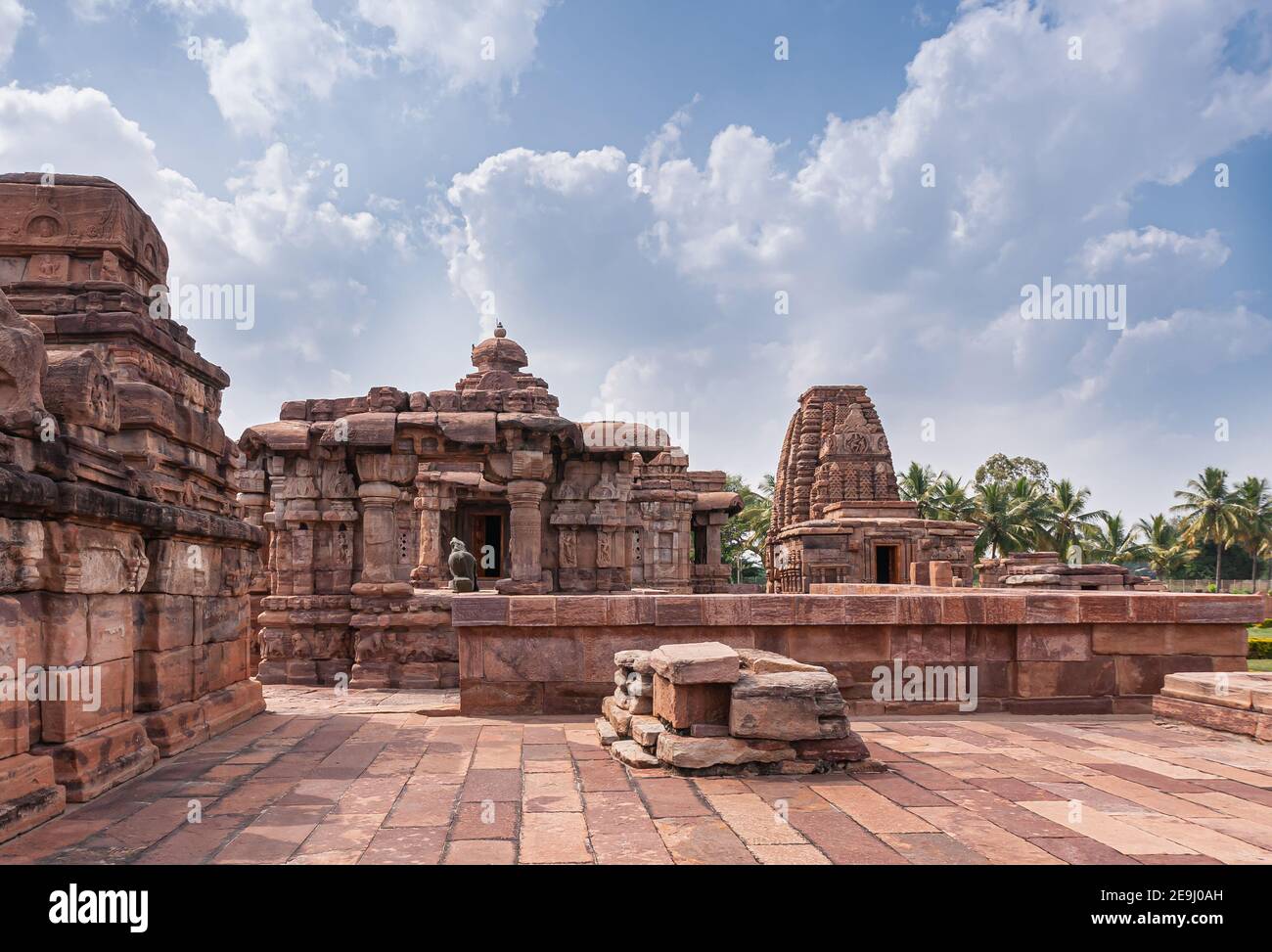 Bagalakote, Karnataka, India - November 7, 2013: Pattadakal temple complex. Brown stone Viriupaksha and Jambulingeshwar temple combination under blue Stock Photo