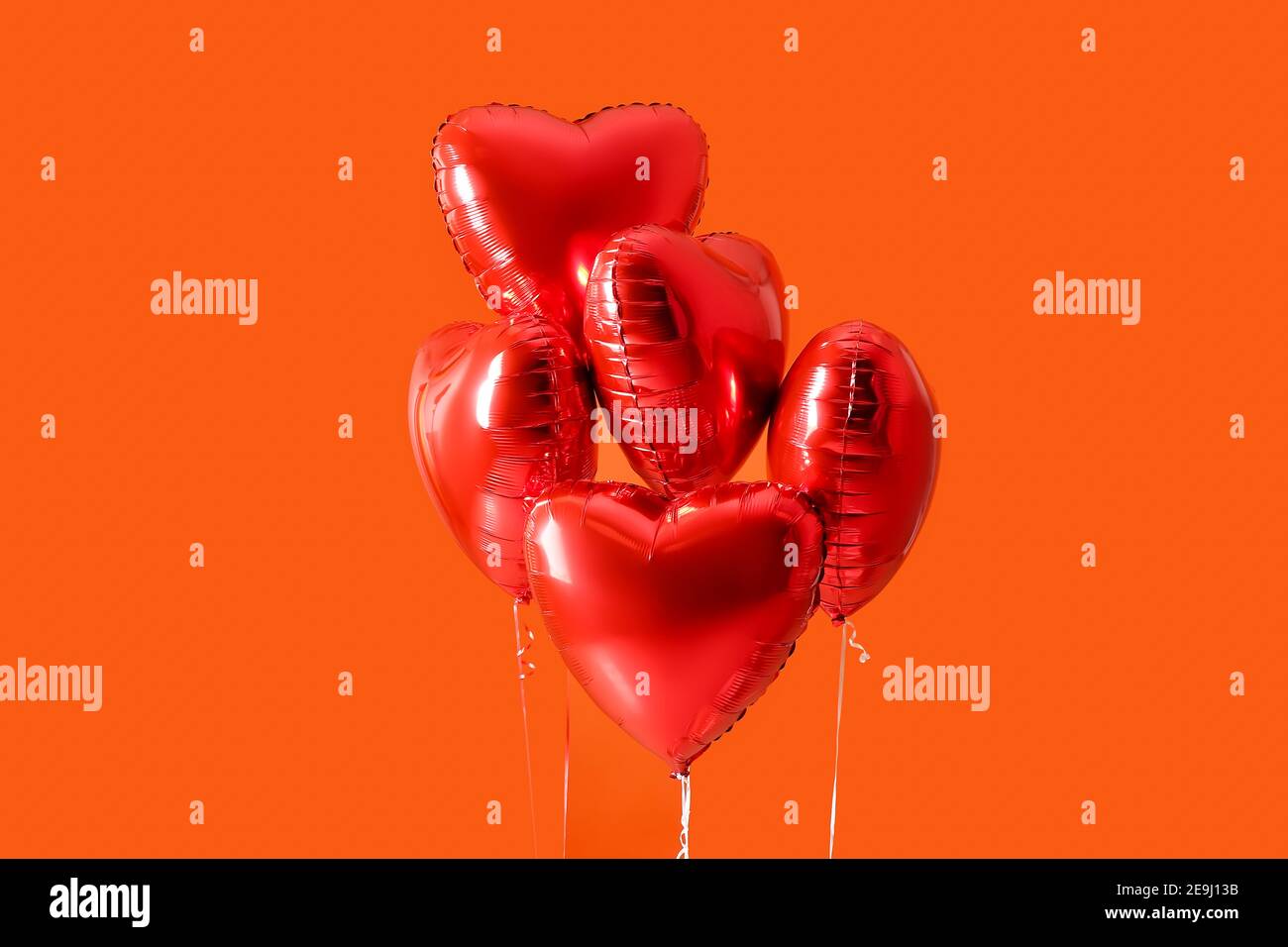 Heart shaped air balloons on color background Stock Photo - Alamy