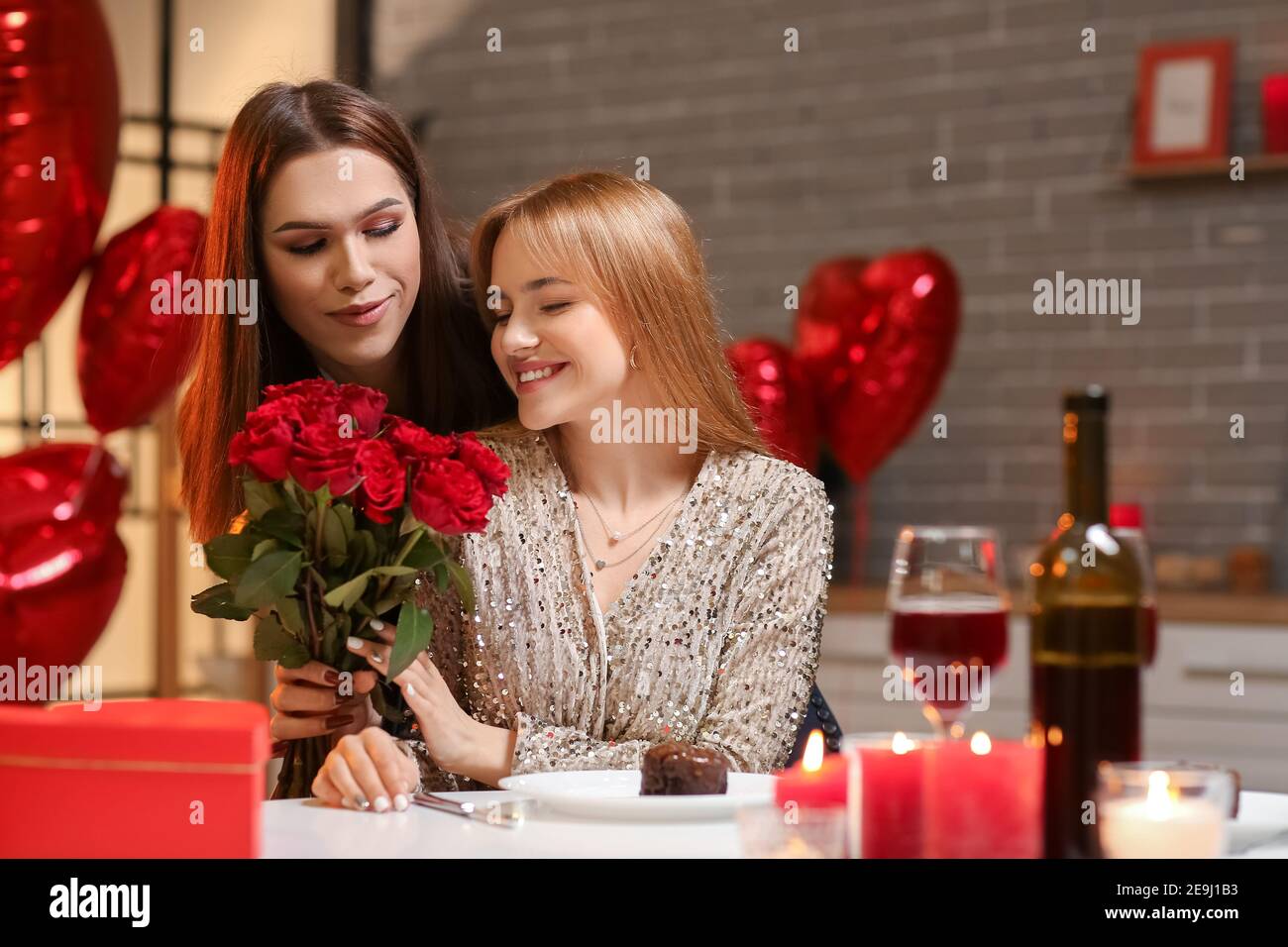 Happy transgender couple celebrating Valentine's Day at home Stock ...