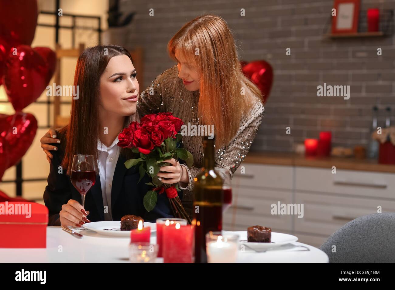 Happy transgender couple celebrating Valentine's Day at home Stock ...