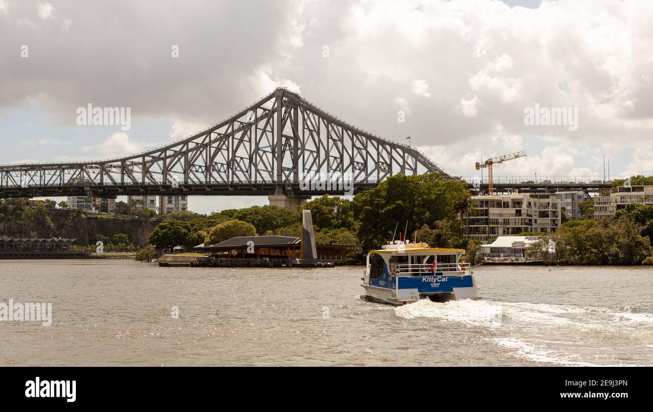 A ferry boat heading towards the Story bridge on the  Brisbane River in Queensland on February 1st 2021 Stock Photo
