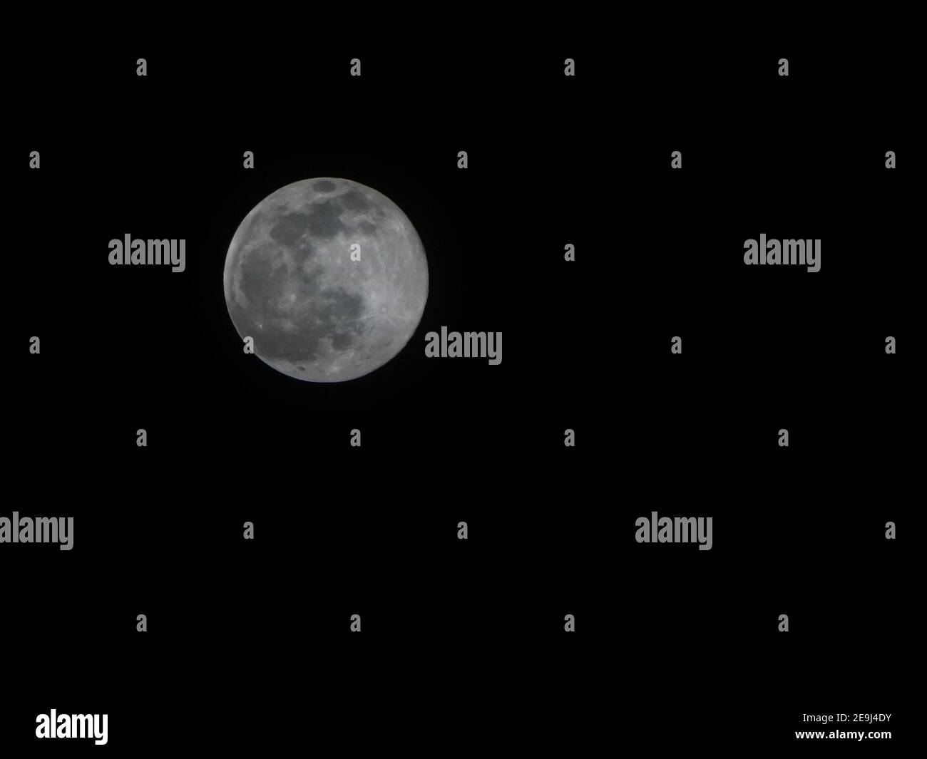 Beautiful full moon isolated on dark black sky background Stock Photo ...
