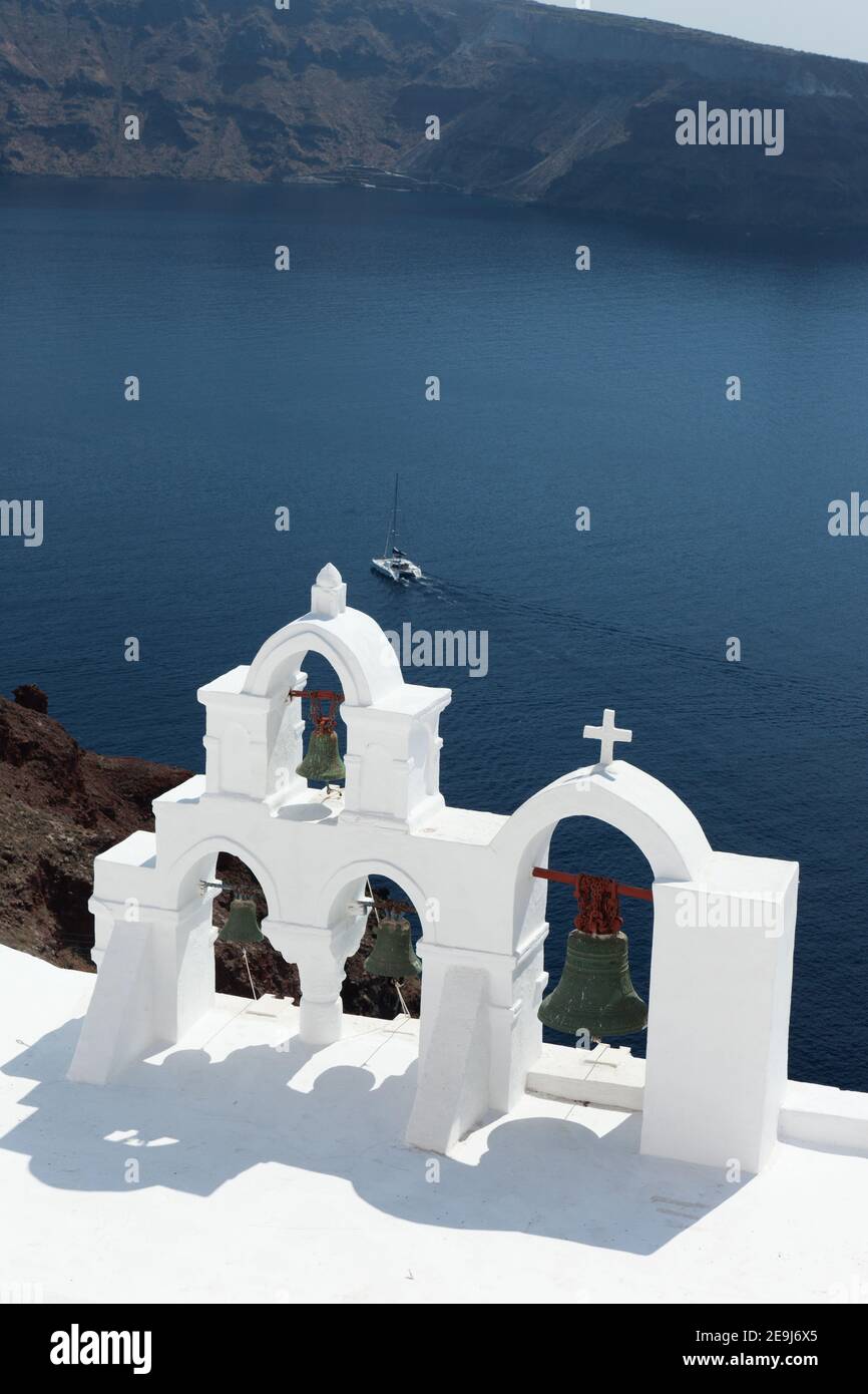 Santorini, Greece, Bell Tower of whitewashed church overlooking the Caldera in Oia. Stock Photo