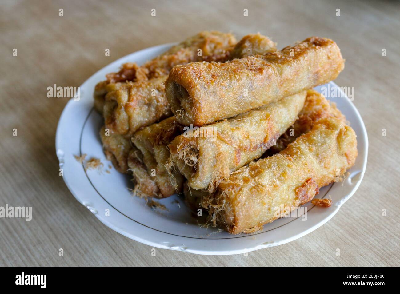 Fried spring rolls or popia or lumpia in white plate Stock Photo