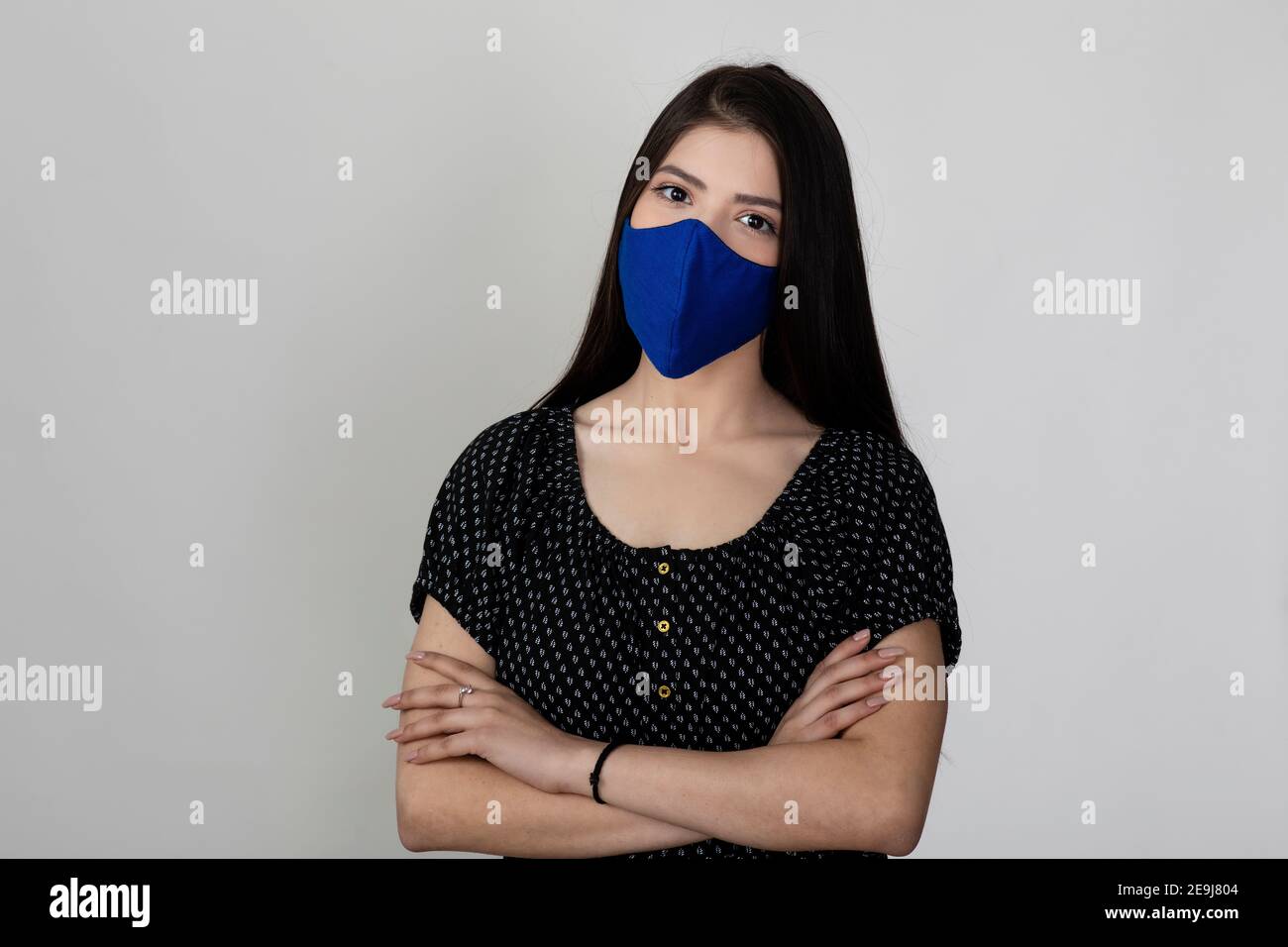 Image of a pretty young girl wearing Covid 19 protection mask and ...