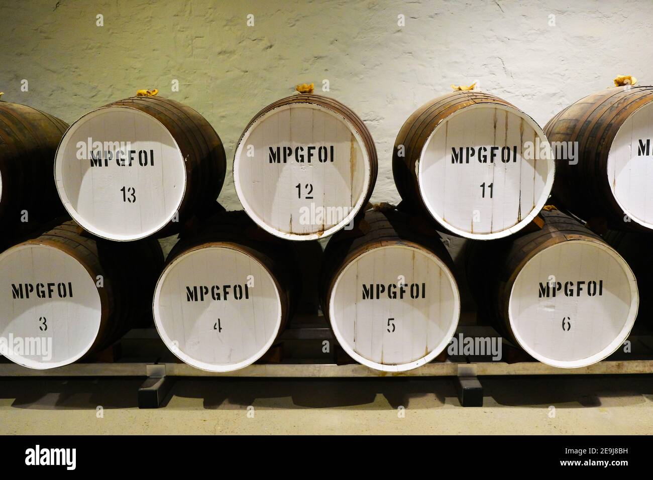 Barrels of wine in the underground cellars of Penfold Wines at Magill in Adelaide Australia Stock Photo