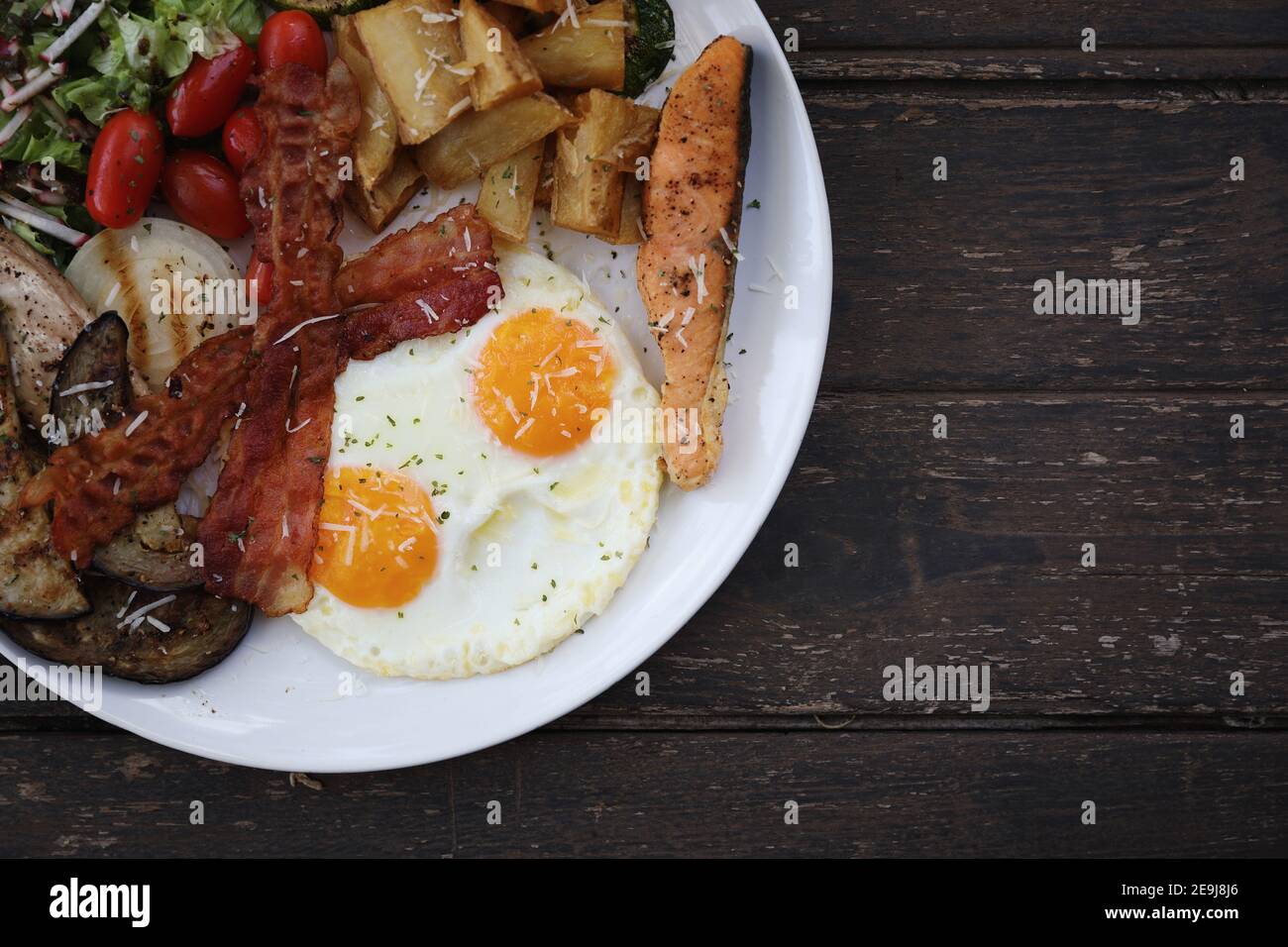 American breakfast with egg bacon sausage and salad Stock Photo