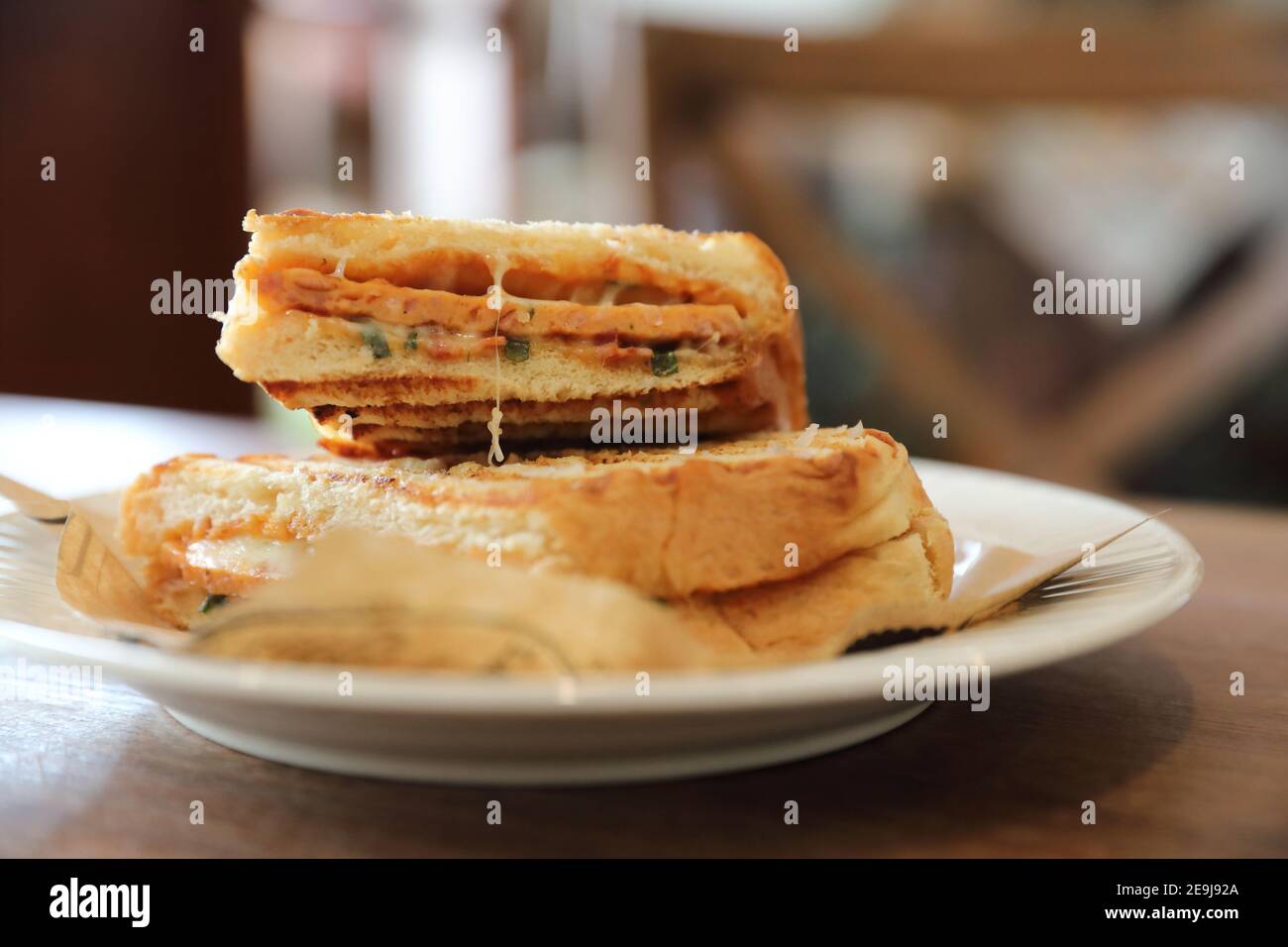 Panini with ham and sausage sandwich Stock Photo Alamy