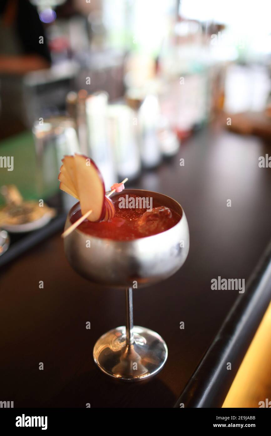 cocktails in glasses on bar counter in pup or restaurant Stock Photo