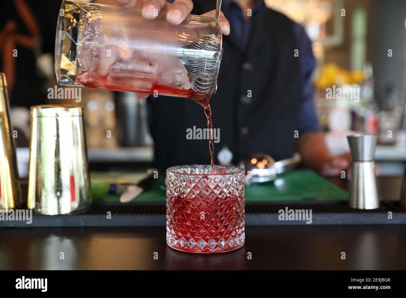 cocktails in glasses on bar counter in pup or restaurant Stock Photo