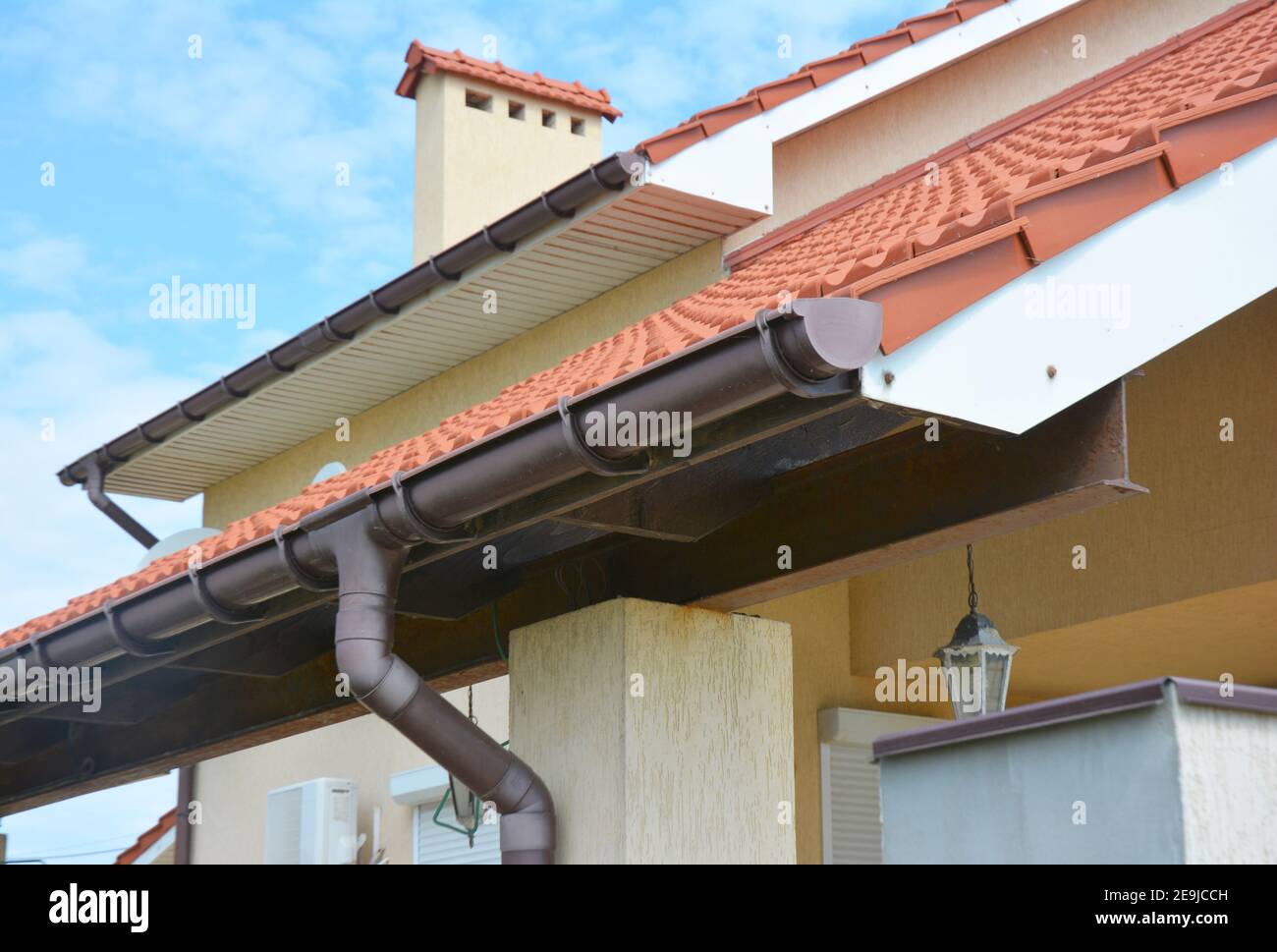 Close up on rain gutter pipeline system with holders and gutter