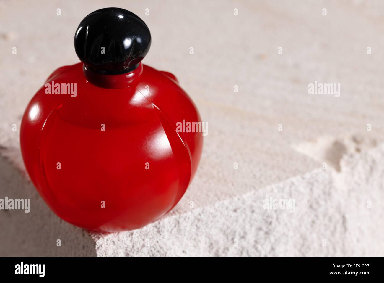 Bottle of perfume on cinder block close up Stock Photo Alamy