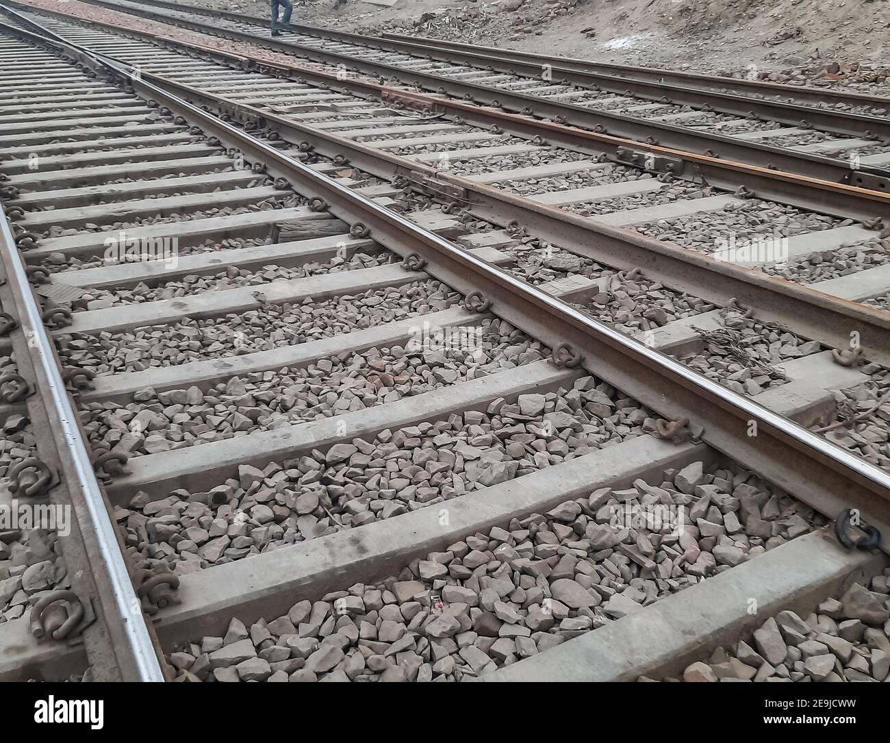 View of Railway Tracks from the middle during day time in Delhi India, Indian Railways track view, Indian Railway junction. Heavy industry view Stock Photo