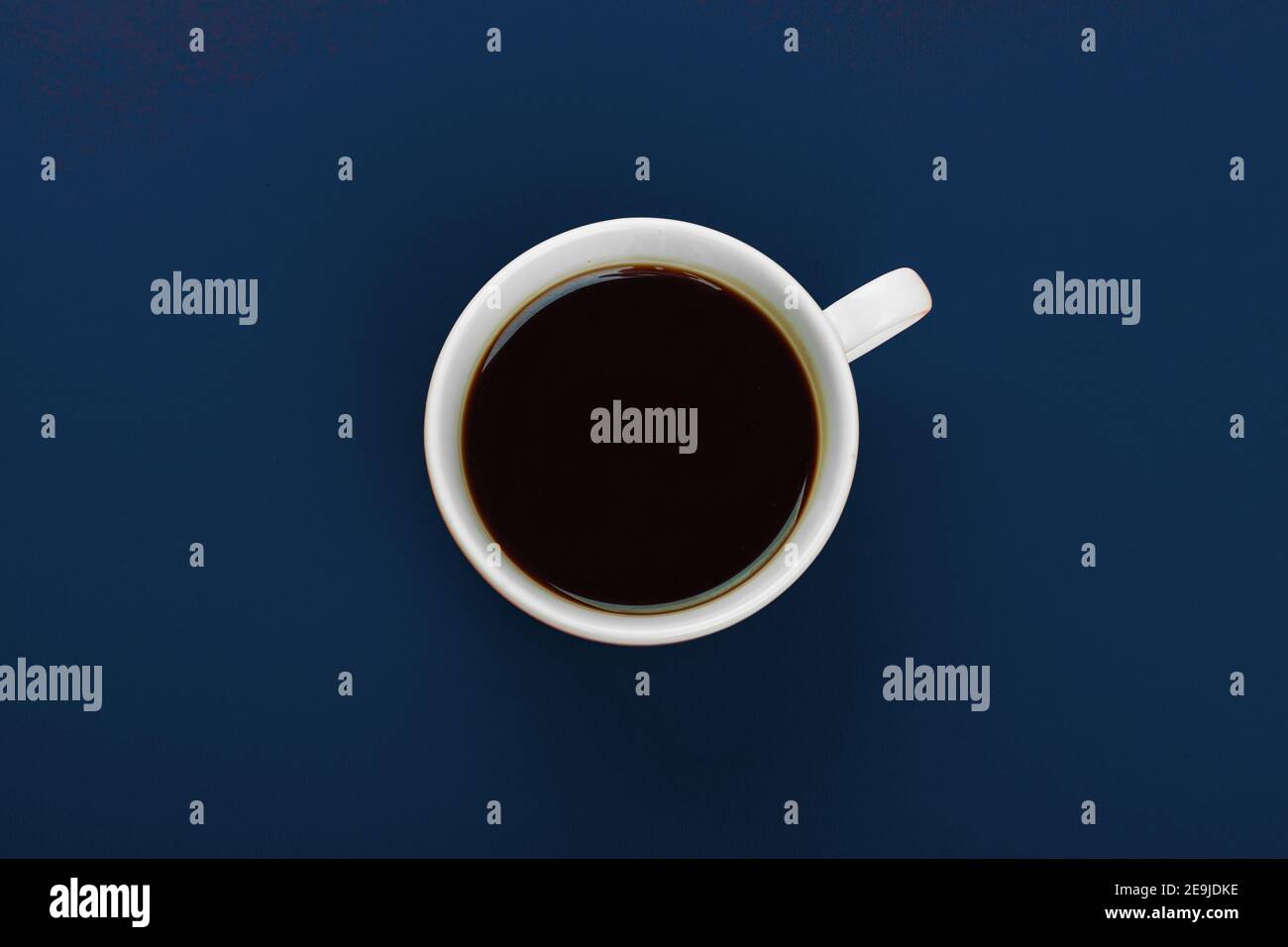 Coffee cup with coffee on classic blue background Stock Photo - Alamy