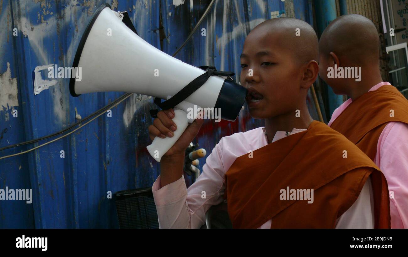 Buddhist nun with the loudspeaker (Myanmar) Stock Photo