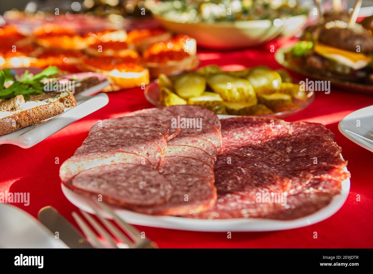 Cutting from selected sausages on the festive table Stock Photo