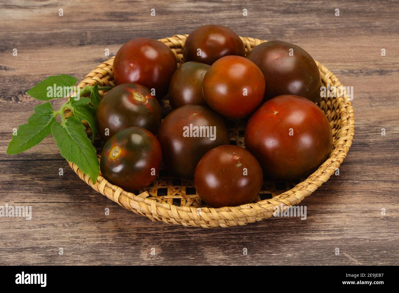 Black tomato tasty fresh ripe Kumato Stock Photo Alamy