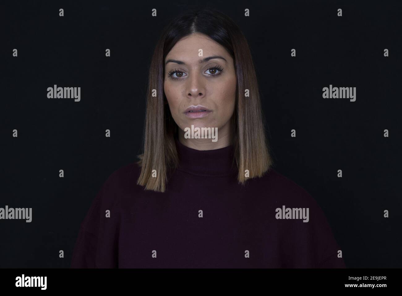 And sad woman with black background Stock Photo - Alamy